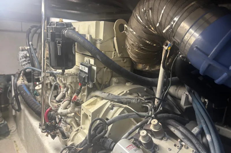 Slide: The Image of Engine compartment of a 2006 Sea Ray 52 Sedan Bridge yacht, showcasing detailed components. - 36