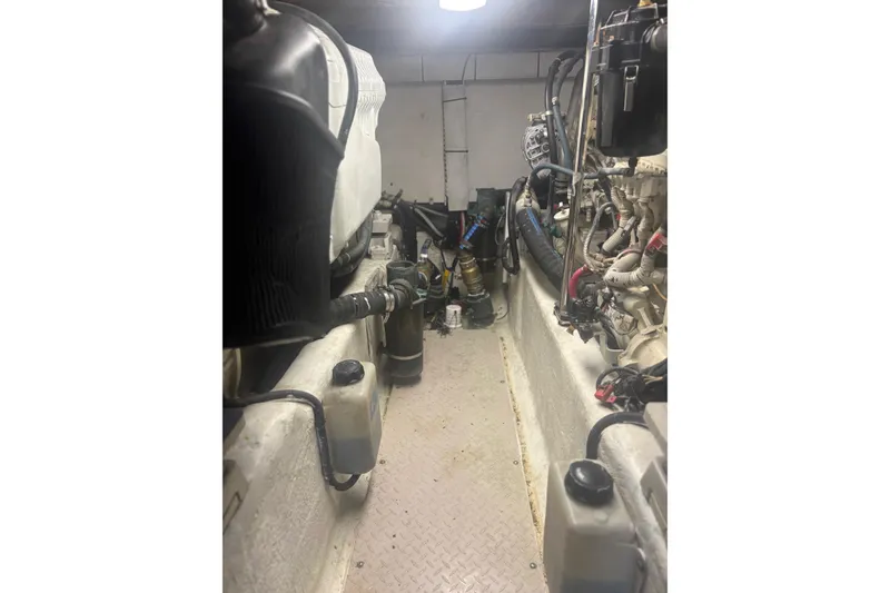 Slide: The Image of Engine room of a 2006 Sea Ray 52 Sedan Bridge yacht, showcasing mechanical components. - 37