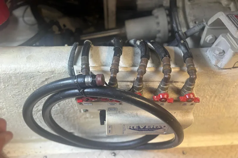 Slide: The Image of Engine compartment of a 2006 Sea Ray 52 Sedan Bridge with Reverso oil change system. - 40