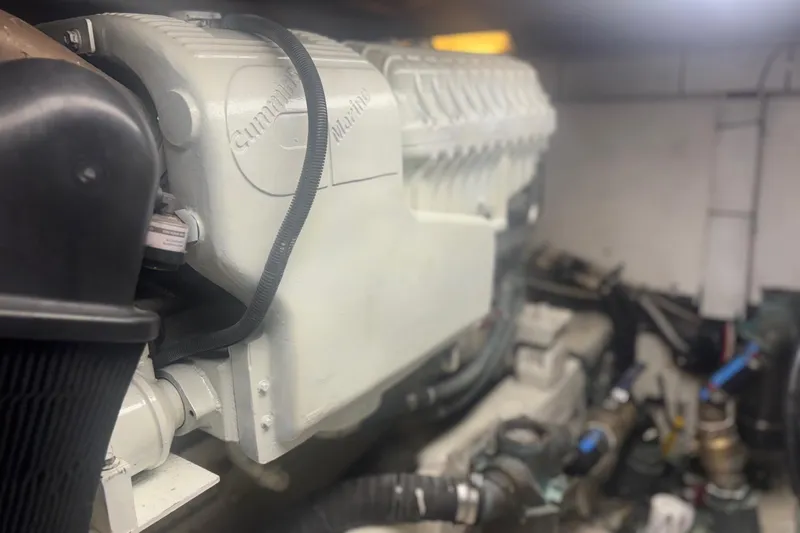 Slide: The Image of Engine room of a 2006 Sea Ray 52 Sedan Bridge yacht, featuring Cummins Marine engine. - 41