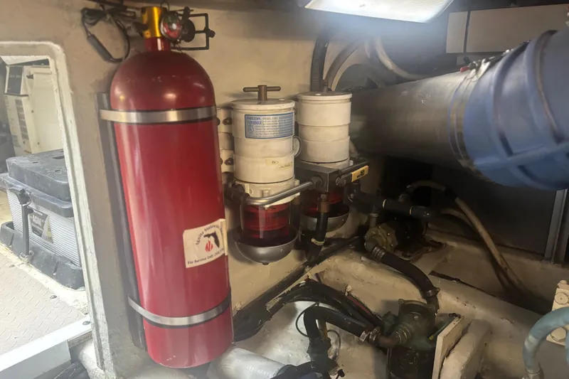 Slide: The Image of Engine room of 2006 Sea Ray 52 Sedan Bridge with fire extinguisher and filtration system. - 45