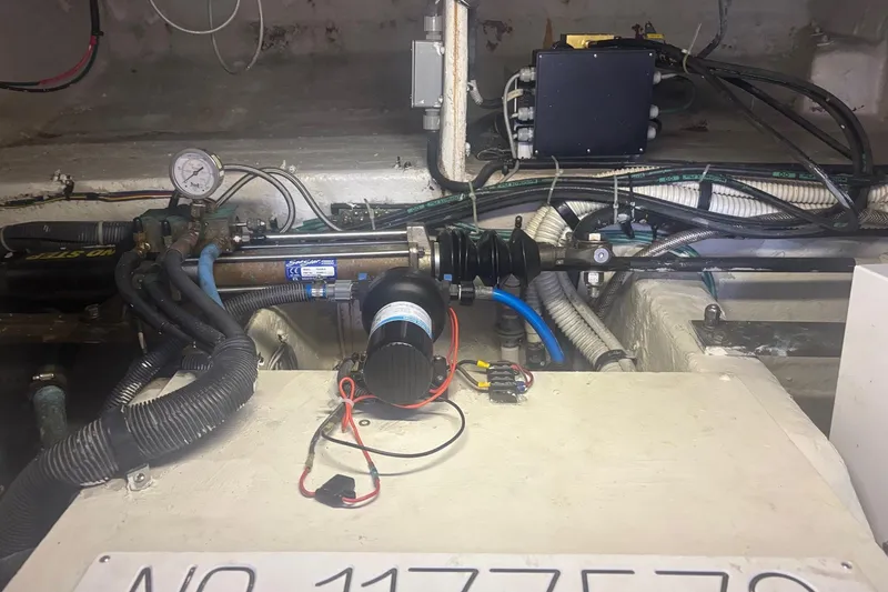 Slide: The Image of Engine room of 2006 Sea Ray 52 Sedan Bridge with visible wiring and components. - 47