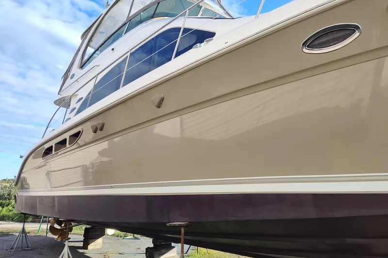 Slide: The Image of 2006 Sea Ray 52 Sedan Bridge yacht on stands, showcasing sleek design and polished exterior. - 49