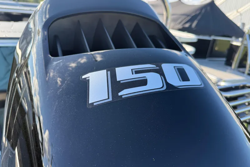 Slide: The Image of Close-up of a 150 horsepower engine on a 2026 Avalon Venture 85 Rear Fish boat. - 11