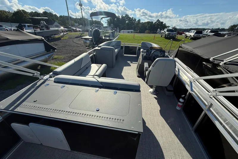 Slide: The Image of 2026 Avalon Venture 85 Rear Fish pontoon boat with spacious seating and modern design. - 5
