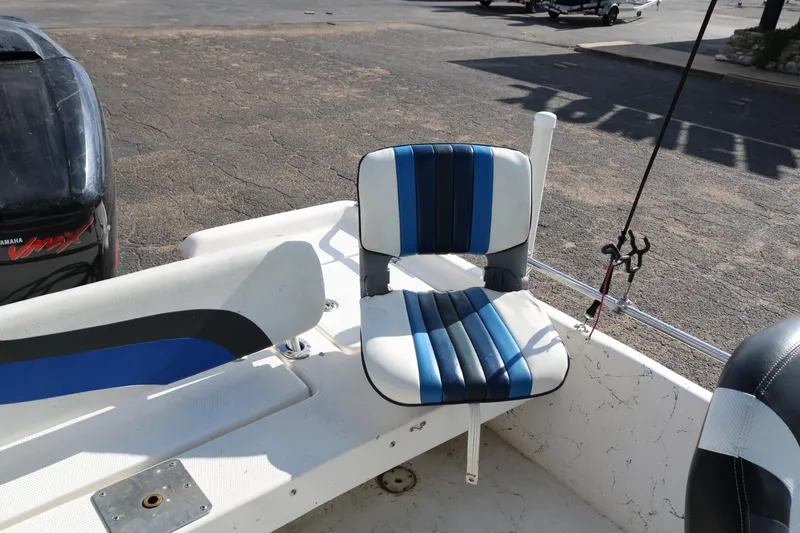 Slide: The Image of 2008 Blue Wave 220 Deluxe Pro boat seat with blue and white upholstery. - 12