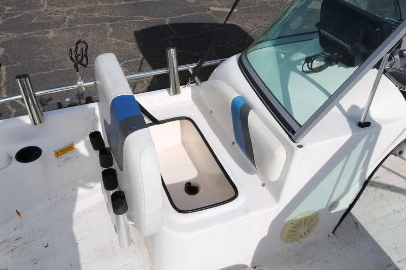 Slide: The Image of 2008 Blue Wave 220 Deluxe Pro boat interior with seating and storage compartment. - 27