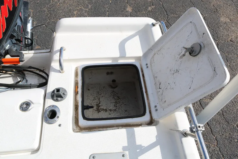 Slide: The Image of Open storage compartment on 2008 Blue Wave 220 Deluxe Pro boat deck. - 33