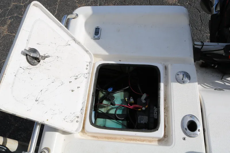 Slide: The Image of Open hatch on 2008 Blue Wave 220 Deluxe Pro boat showing battery compartment. - 35