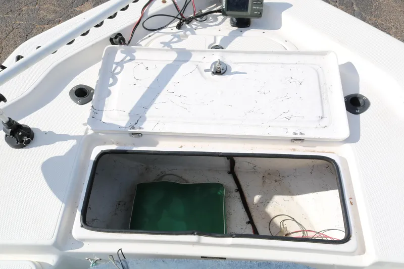Slide: The Image of Open storage compartment on 2008 Blue Wave 220 Deluxe Pro boat with visible wiring. - 37