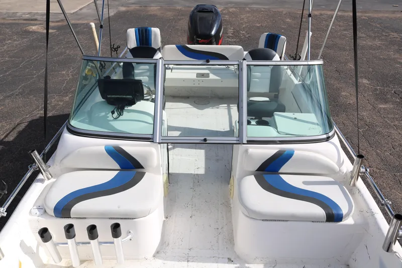 Slide: The Image of 2008 Blue Wave 220 Deluxe Pro boat interior with seating and windshield. - 38