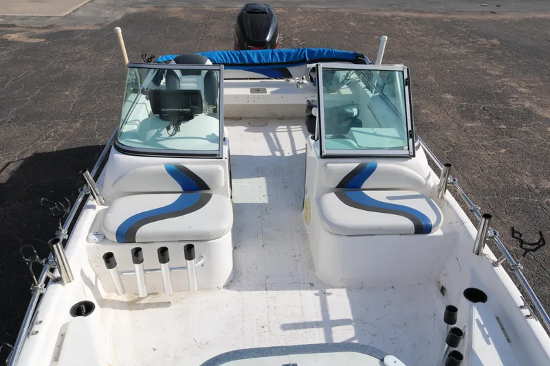 Slide: The Image of 2008 Blue Wave 220 Deluxe Pro boat interior with dual consoles and seating. - 8