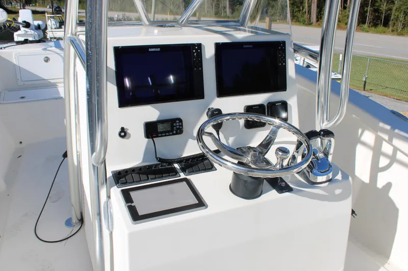 Slide: The Image of Control console of 2020 AMERICAT 27cc boat with dual screens and steering wheel. - 16
