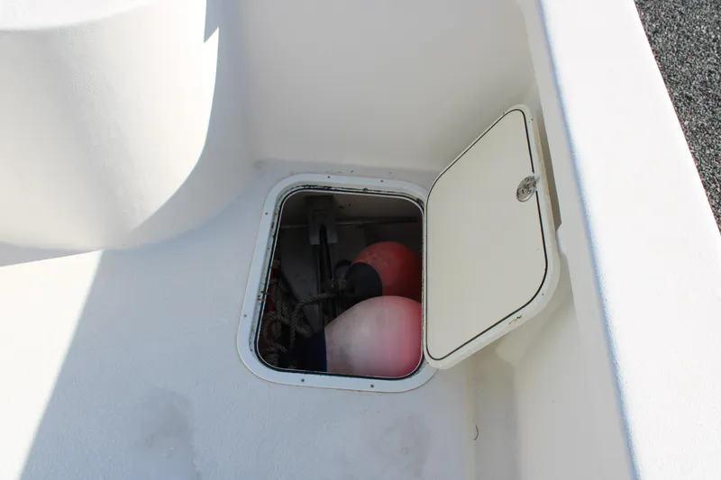 Slide: The Image of Open storage compartment on 2020 AMERICAT 27cc boat with buoys and ropes inside. - 18