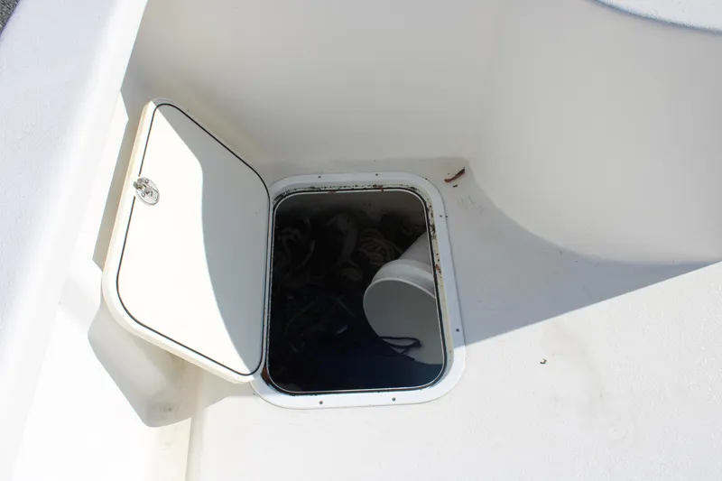 Slide: The Image of Open storage compartment on 2020 AMERICAT 27cc boat deck. - 19