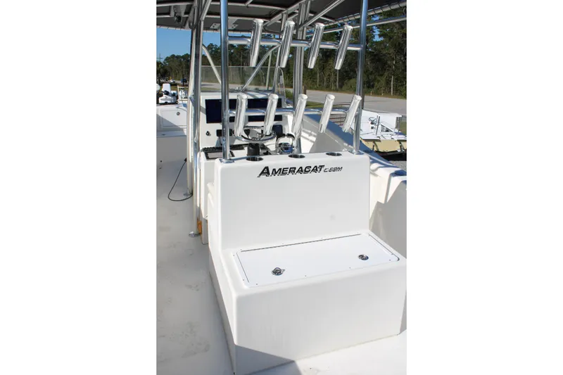 Slide: The Image of 2020 AMERICAT 27cc boat interior with rod holders and storage compartment. - 22