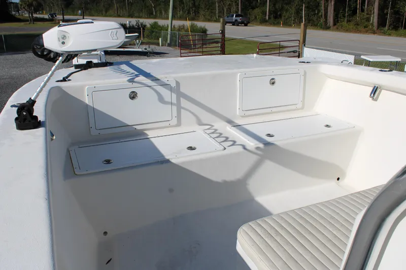 Slide: The Image of 2020 AMERICAT 27cc boat interior with storage compartments and seating. - 24