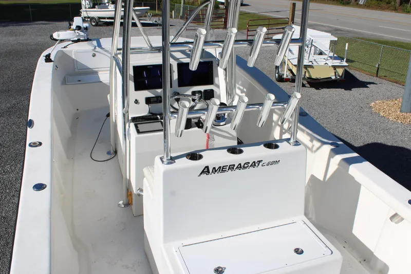 Slide: The Image of 2020 AMERICAT 27cc boat interior with rod holders and control panel. - 30
