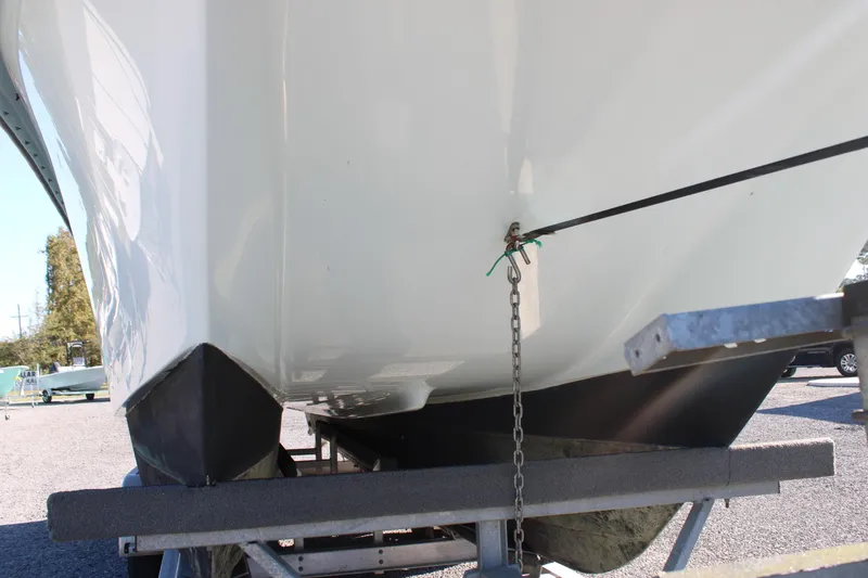 Slide: The Image of 2020 AMERICAT 27cc boat on trailer, secured with chain and strap. - 8