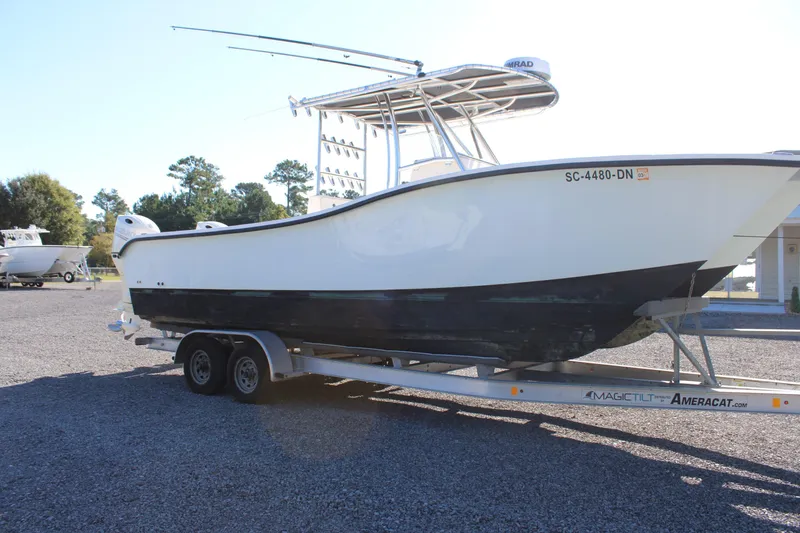 Slide: The Image of 2020 AMERICAT 27cc boat on trailer in outdoor setting. - 9