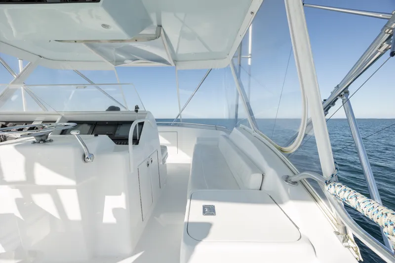 Slide: The Image of Helm of 2000 Hatteras 50 Convertible yacht with ocean view. - 14