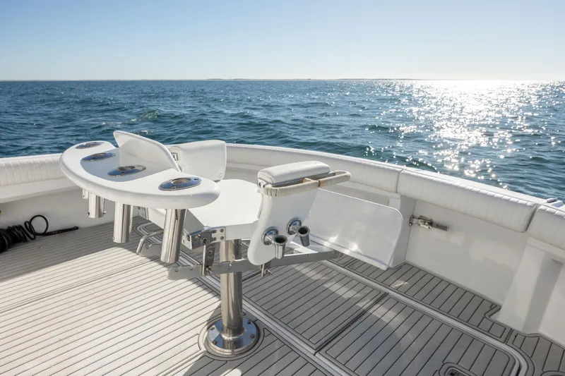 Slide: The Image of Hatteras 50 Convertible 2000 yacht deck with fishing chair, ocean view. - 23