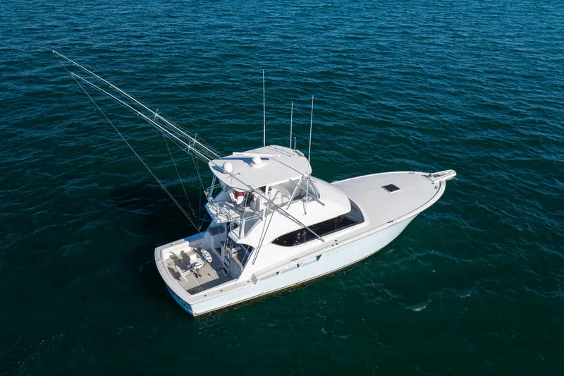Slide: The Image of Aerial view of 2000 Hatteras 50 Convertible yacht on open water. - 3