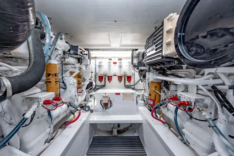 Slide: The Image of Engine room of 2000 Hatteras 50 Convertible yacht, featuring CAT marine engines. - 37