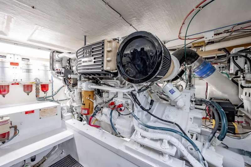 Slide: The Image of Engine room of 2000 Hatteras 50 Convertible yacht, featuring CAT marine power engine. - 40