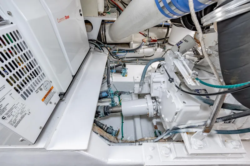 Slide: The Image of Engine room of 2000 Hatteras 50 Convertible yacht, featuring Cummins Onan generator. - 45