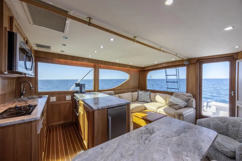Slide: The Image of Luxurious interior of 2000 Hatteras 50 Convertible yacht with ocean view and modern amenities. - 49