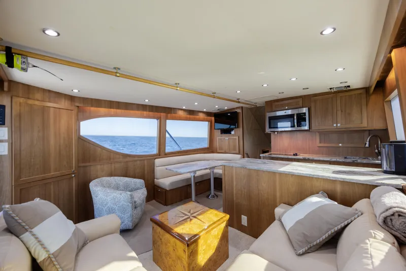 Slide: The Image of Luxurious interior of 2000 Hatteras 50 Convertible yacht with ocean view. - 51