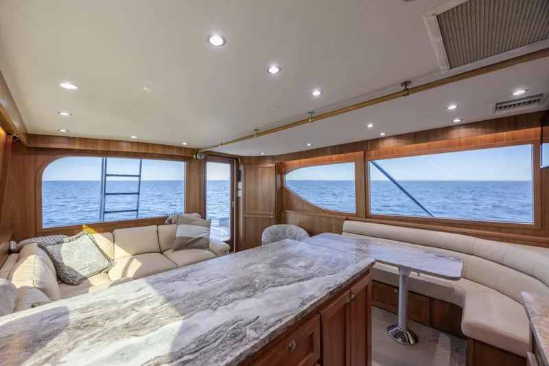 Slide: The Image of Luxurious interior of 2000 Hatteras 50 Convertible yacht with ocean view. - 55