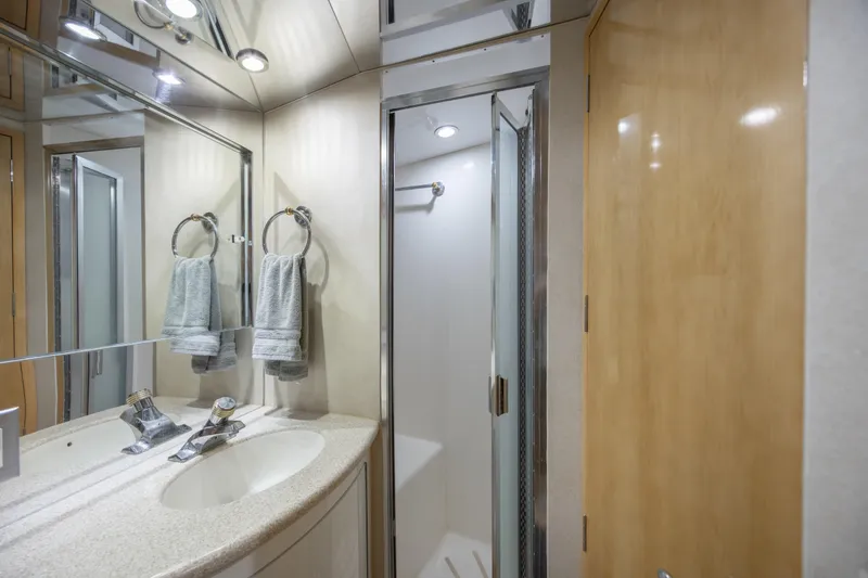 Slide: The Image of Luxurious bathroom in 2000 Hatteras 50 Convertible yacht with modern fixtures and shower. - 65