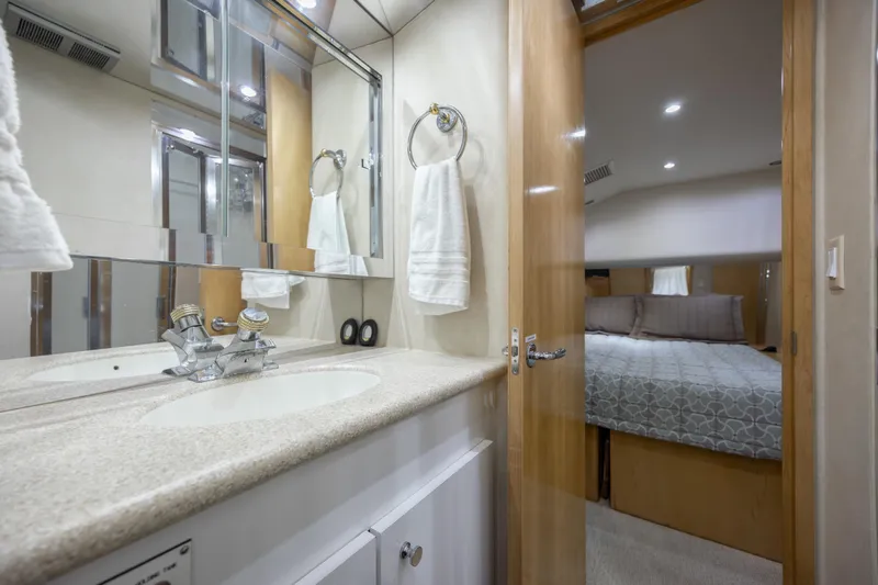 Slide: The Image of Luxurious bathroom and bedroom interior of 2000 Hatteras 50 Convertible yacht. - 74
