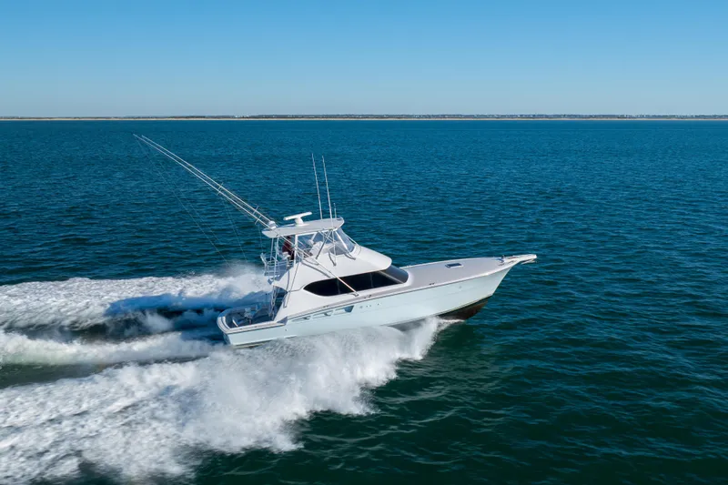 Slide: The Image of Hatteras 50 Convertible yacht cruising on open water, 2000 model. - 75
