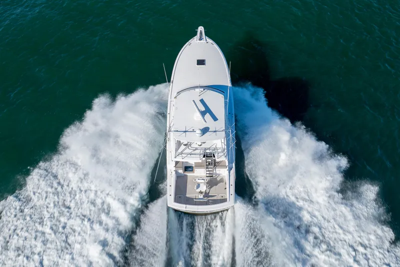 Slide: The Image of Aerial view of 2000 Hatteras 50 Convertible yacht cruising on open water. - 84