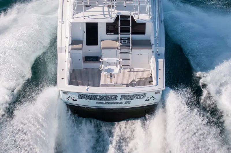 Slide: The Image of Aerial view of 2000 Hatteras 50 Convertible yacht cruising on water. - 88