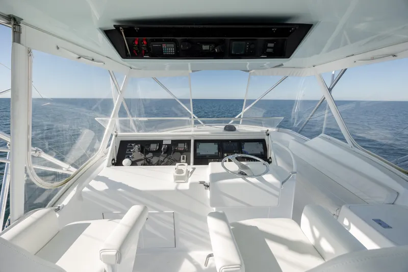 Slide: The Image of Helm of 2000 Hatteras 50 Convertible yacht with ocean view. - 9