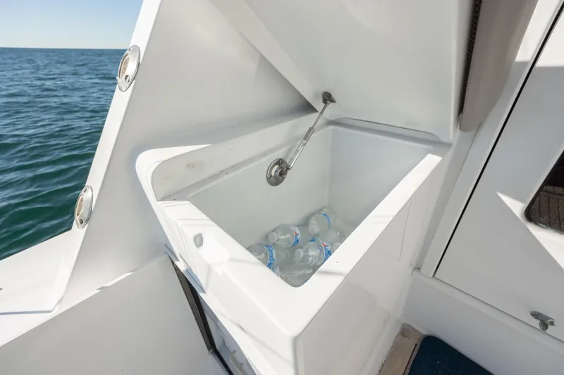 Slide: The Image of Open cooler with water bottles on a 2000 Hatteras 50 Convertible yacht. - 29
