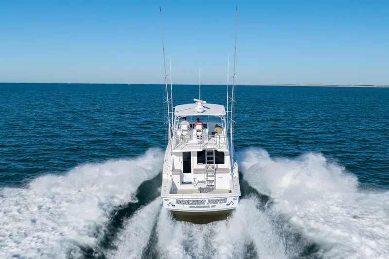 Slide: The Image of Hatteras 50 Convertible yacht cruising on open sea, 2000 model. - 81