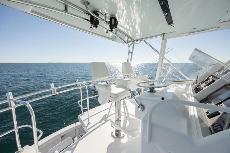 Slide: The Image of Hatteras 50 Convertible 2000 yacht helm with ocean view and seating. - 13