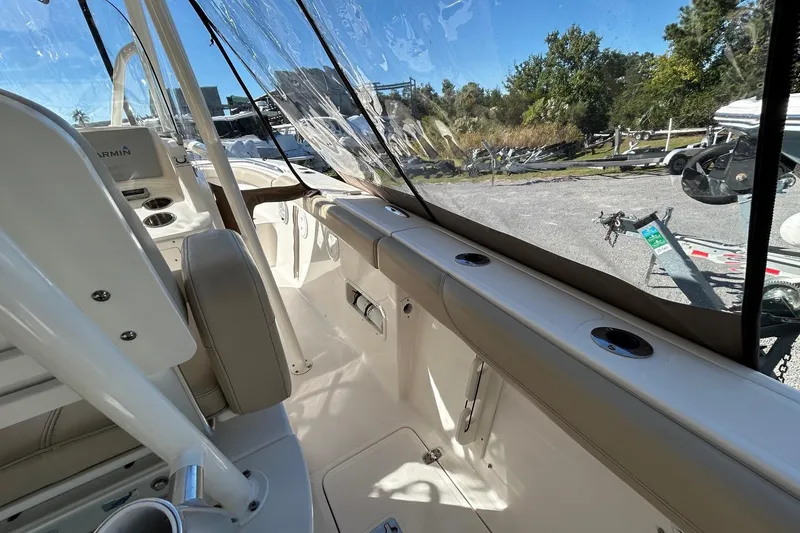 Slide: The Image of 2015 Pursuit C 280 Center Console interior with seating and console details. - 12