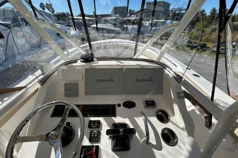 Slide: The Image of 2015 Pursuit C 280 Center Console boat dashboard with Garmin navigation system. - 9