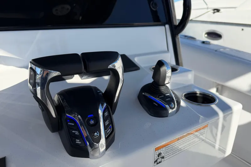 Slide: The Image of 2024 Sportsman Open 282TE Center Console controls with joystick and throttle. - 13