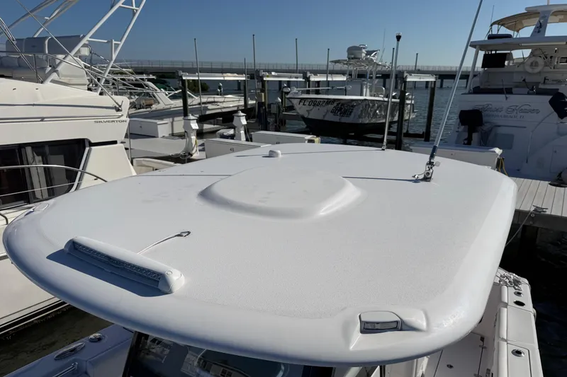 Slide: The Image of 2024 Sportsman Open 282TE Center Console boat docked at marina. - 18