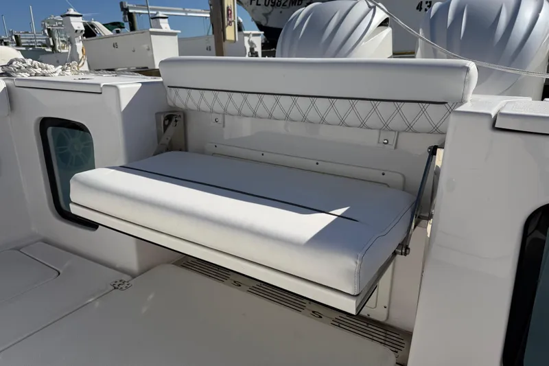 Slide: The Image of 2024 Sportsman Open 282TE Center Console with foldable white bench seat. - 24