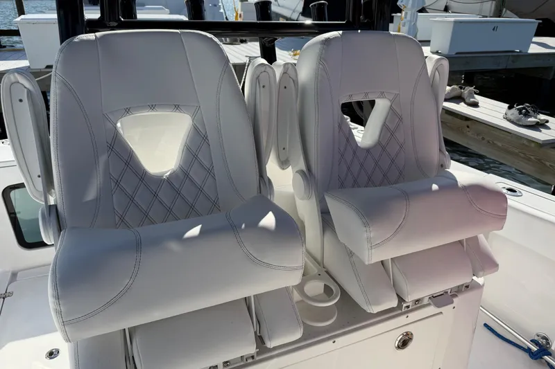 Slide: The Image of 2024 Sportsman Open 282TE Center Console boat seats with diamond stitching design. - 29