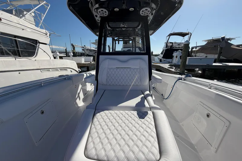 Slide: The Image of 2024 Sportsman Open 282TE Center Console boat interior at marina. - 32
