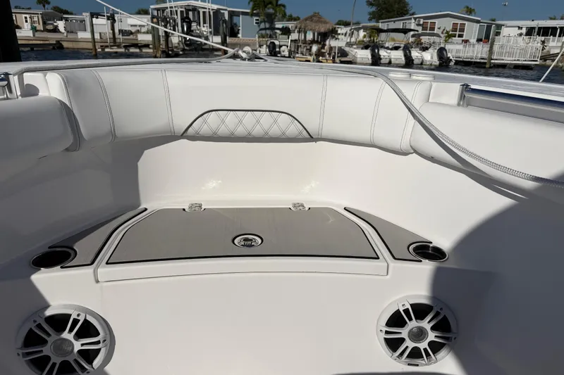 Slide: The Image of 2024 Sportsman Open 282TE Center Console boat interior with seating and speakers. - 33